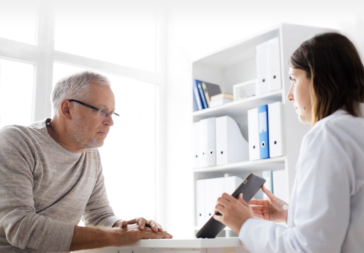 Health professional with patient explaining results